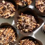 Golden baked banana muffins photographed on a plate