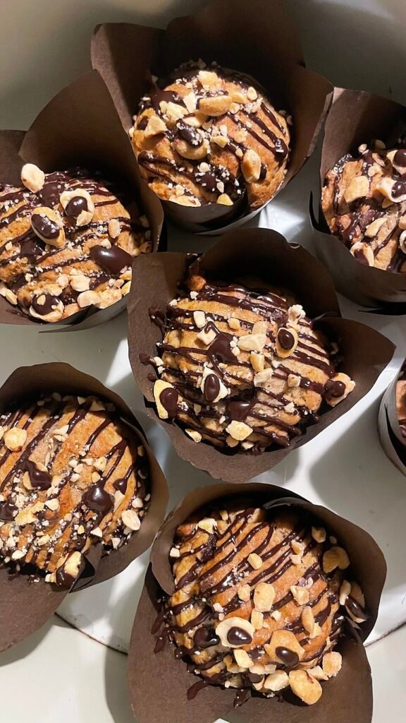 Golden baked banana muffins photographed on a plate