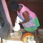 Baker measuring flour while preparing baked goods