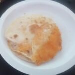 Golden folded cheese quesadilla ready to serve